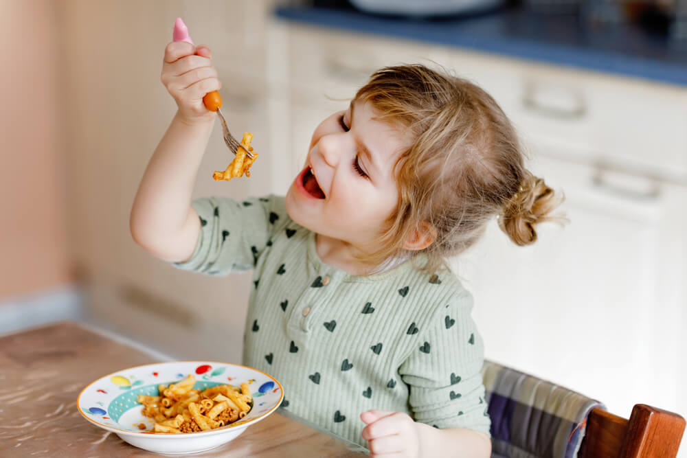 Toddler Girl Eat Pasta Macaroni Bolognese With Minced Meat