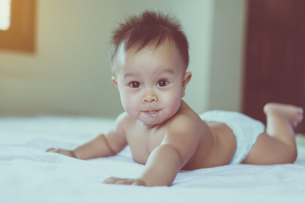 Baby wakes up deals because of spit up