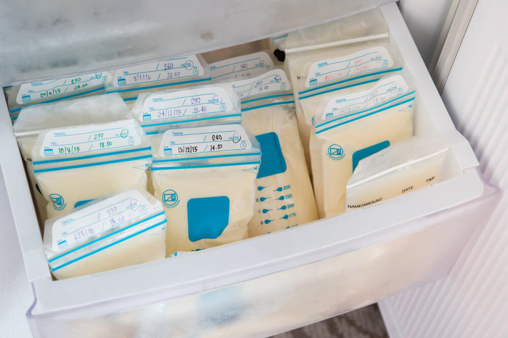 Breast Milk in Plastic Bags on Refrigerator Shelf, Frozen Mother Milk for Infant, Breastfeeding