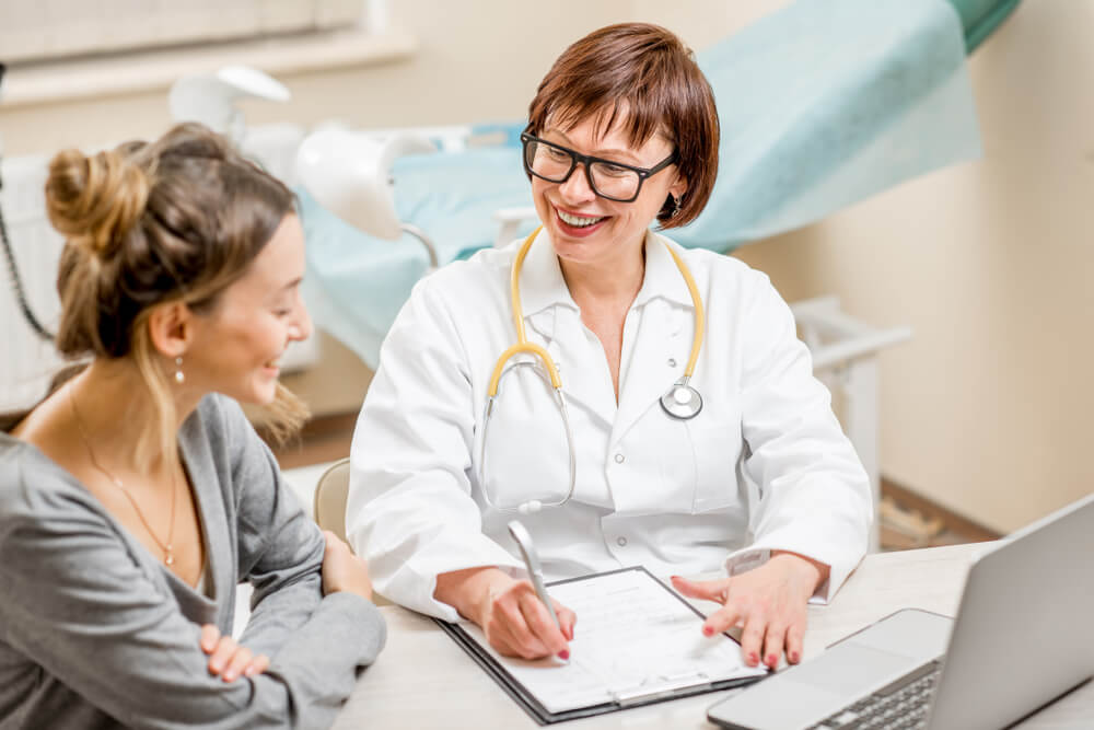 Young Woman Patient With a Senior Gynecologist During the Consultation in the Office