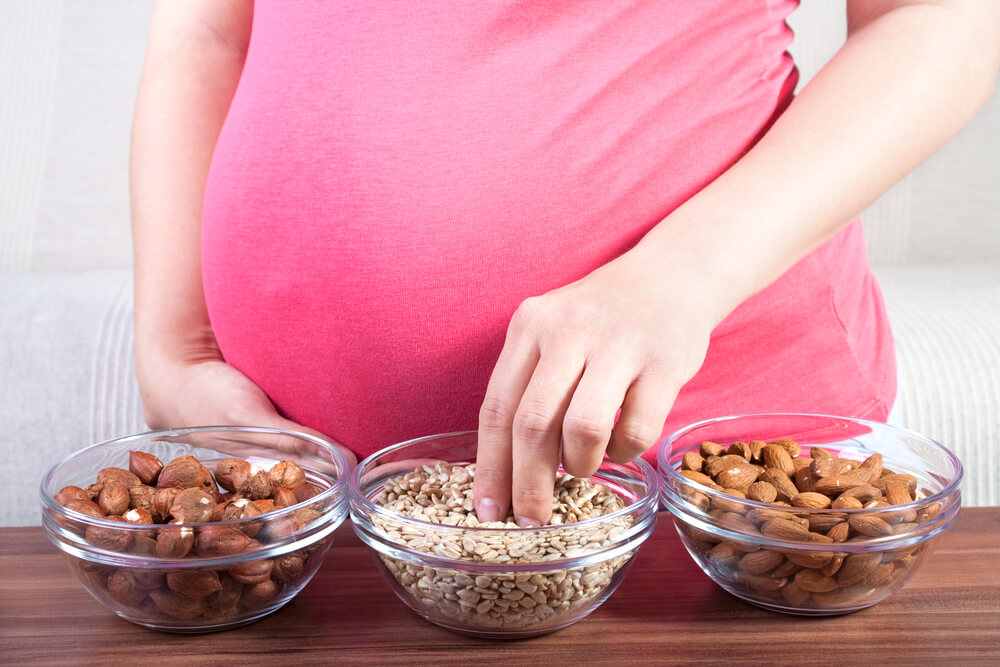 Pregnant Woman Eating Different Seeds