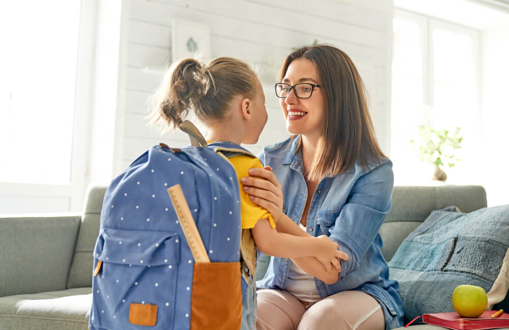 Woman and Girl With Backpack Behind Back. Beginning of Lessons. First Day of School.