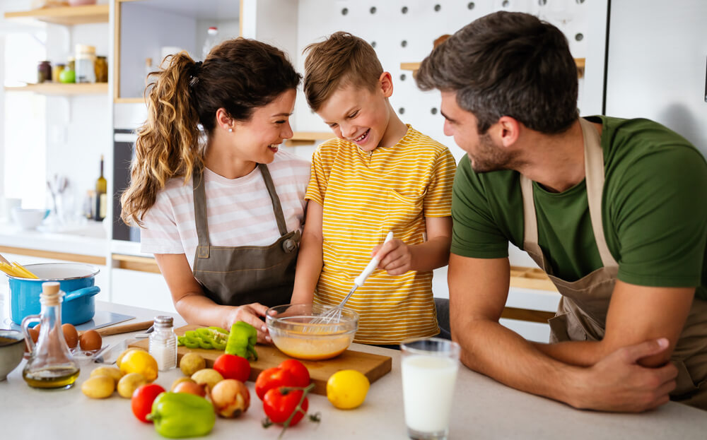 Happy Family in the Kitchen Having Fun and Cooking Together.