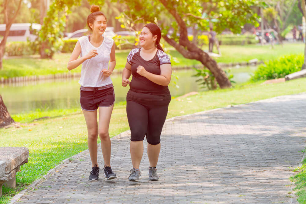 Asian Two Thin and Fat Girls Friend Running Jogging Park Outdoor in the Morning