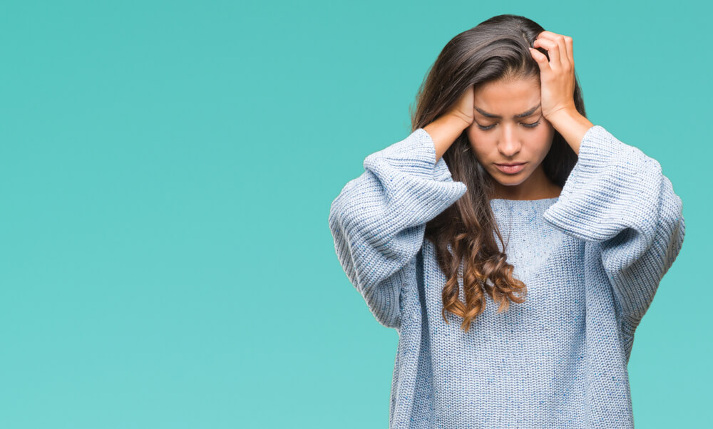 Young Beautiful Woman Wearing Winter Sweater Over Isolated Background Suffering From Headache Desperate and Stressed Because Pain and Migraine